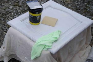 De nibbing primed doors and applying filler where needed 